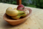 Preview: Handgefertigte Schale aus Lärchenholz von mARTinWood mit frischem Obst